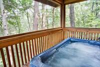 Private hot tub on the screened in deck